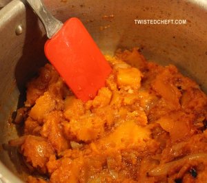 Mixing The Roasted Squash With The Curry Paste Mixture
