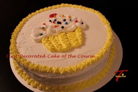 This is my first decorated cake of the course. I had some issues with icing of the cake because it was not thin enough as I realized later. Also there were crumbs visible on the sides of the cake.