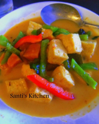 A Facebook Exclusive! Crispy tofu simmered in coconut milk, curry green paste by Santi of Santi's Kitchen. We carnivores do need to feed our herbivore friends and family. This is a great dish for just such a meal. I love the combination of Thai curry with coconut milk. Picture courtesy of Santi's Kitchen www.facebook.com/lmsmto